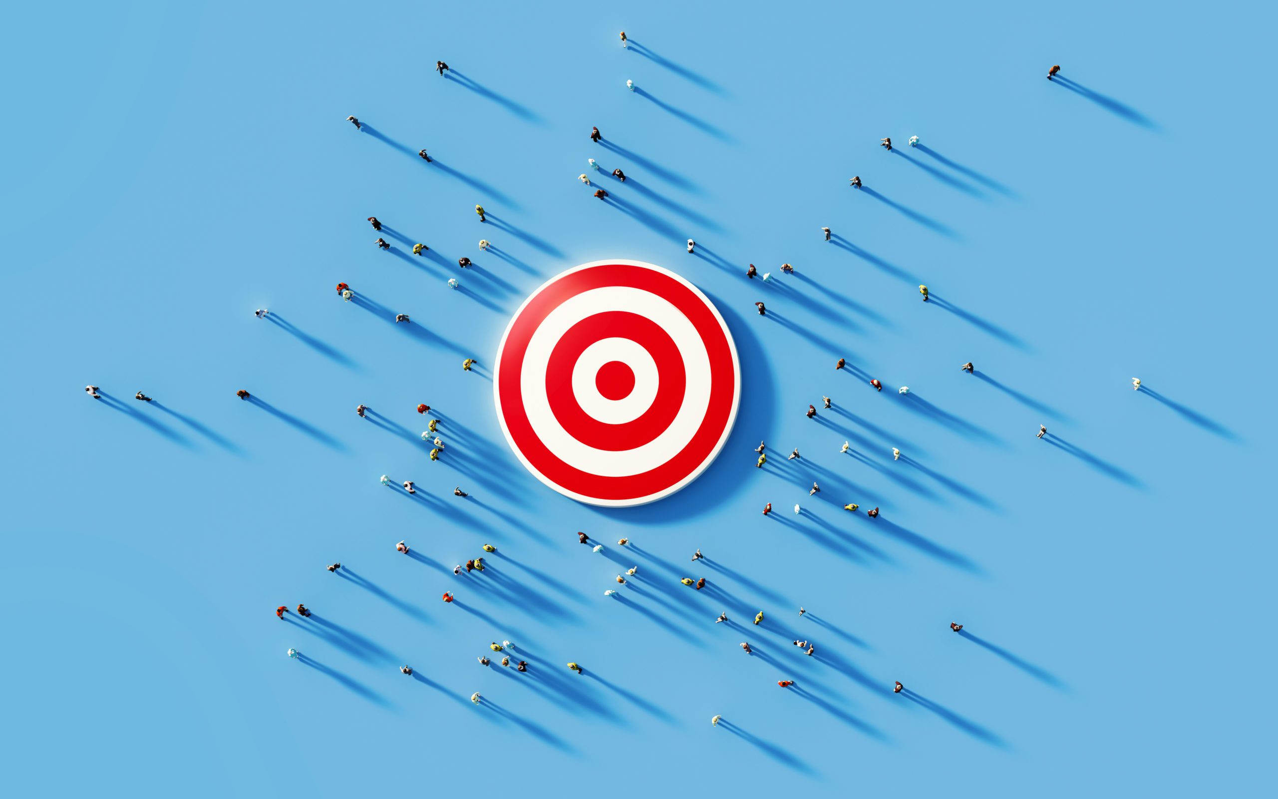 Human crowd gathering around a red bulls eye on blue background. Horizontal composition with copy space. Clipping path is included. Marketing and target audience concept